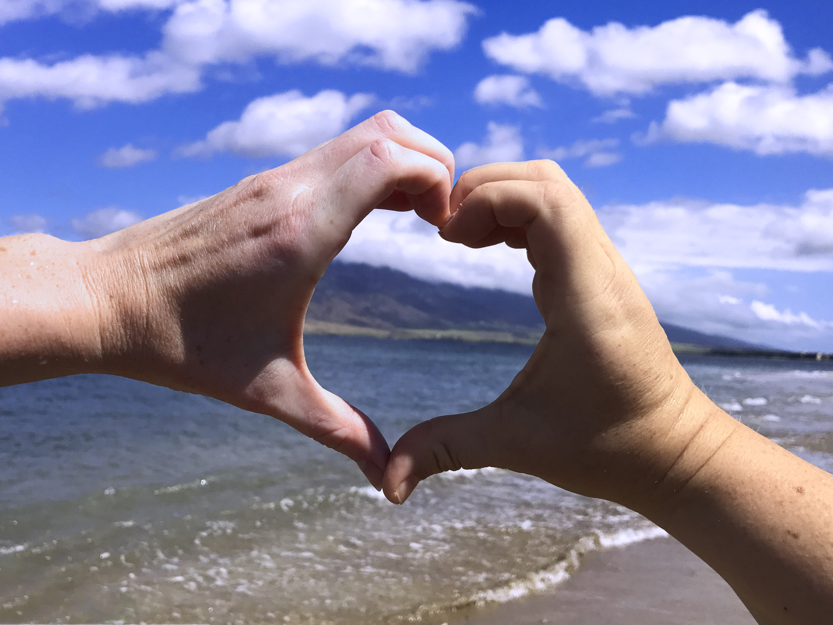 My sister and I using our hands to make a heart shape together